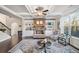 Cozy living room featuring a stone fireplace, built-in shelves, and comfortable seating at 9475 Dunmoore Dr, Cumming, GA 30028