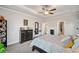 Main bedroom with a tray ceiling, carpeted floors, and a dresser with decor at 9475 Dunmoore Dr, Cumming, GA 30028