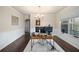 Office featuring a modern chandelier, neutral walls, hardwood floors and a large window at 9475 Dunmoore Dr, Cumming, GA 30028