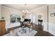 Bright office space with hardwood floors, neutral walls, and a modern chandelier at 9475 Dunmoore Dr, Cumming, GA 30028