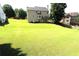 Large backyard with spacious lawn and mature trees at 3854 Heritage Crest Pkwy, Buford, GA 30519