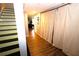 Finished basement hallway with light flooring and curtains at 3854 Heritage Crest Pkwy, Buford, GA 30519