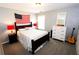 Bedroom with a queen-size bed, dresser, and guitar at 3854 Heritage Crest Pkwy, Buford, GA 30519