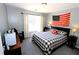 Spacious bedroom with a king-size bed and American flag decor at 3854 Heritage Crest Pkwy, Buford, GA 30519