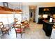 Bright dining area with a wooden table and chairs near the kitchen at 3854 Heritage Crest Pkwy, Buford, GA 30519