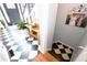 Stylish entryway with black and white checkered floor and staircase at 3854 Heritage Crest Pkwy, Buford, GA 30519