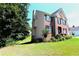 Two story brick home with landscaped yard at 3854 Heritage Crest Pkwy, Buford, GA 30519
