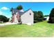 Two-story home with attached garage and landscaping at 3854 Heritage Crest Pkwy, Buford, GA 30519