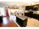 Modern kitchen with granite countertops, dark cabinets, and an island at 3854 Heritage Crest Pkwy, Buford, GA 30519