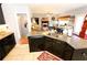 Eat-in kitchen with granite countertops, dark cabinets, and an island at 3854 Heritage Crest Pkwy, Buford, GA 30519