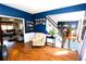 Open living room with hardwood floors and views into dining and kitchen areas at 3854 Heritage Crest Pkwy, Buford, GA 30519