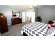 Main bedroom with king-size bed, dresser, and access to the upstairs hallway at 3854 Heritage Crest Pkwy, Buford, GA 30519