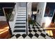 Elegant staircase with black and white risers and white railing at 3854 Heritage Crest Pkwy, Buford, GA 30519
