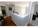 Upstairs hallway with wood flooring, access to bedrooms, and a chandelier at 3854 Heritage Crest Pkwy, Buford, GA 30519