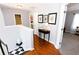 Upstairs hallway with hardwood floors and framed photos at 3854 Heritage Crest Pkwy, Buford, GA 30519