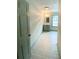 The hallway leads to a full bathroom with single vanity and good natural light from the window at 5619 Mayfair Crossing Dr, Lithonia, GA 30038