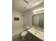 Well-lit bathroom with a gray vanity, tiled shower, and neutral color palette at 5619 Mayfair Crossing Dr, Lithonia, GA 30038