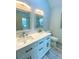 Bathroom featuring dual sinks, tile flooring, a toilet, and two mirrors at 5619 Mayfair Crossing Dr, Lithonia, GA 30038