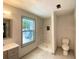 Updated bathroom with a sleek vanity and a walk-in shower featuring modern, elegant tile work at 5619 Mayfair Crossing Dr, Lithonia, GA 30038