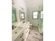 Bathroom featuring dual sinks, tile flooring, a toilet, and a glass shower at 5619 Mayfair Crossing Dr, Lithonia, GA 30038