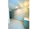 Bright bathroom features white wood flooring, a single sink vanity, and natural light at 5619 Mayfair Crossing Dr, Lithonia, GA 30038