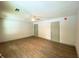Spacious bedroom with laminate floors features two doors and a ceiling fan with light at 5619 Mayfair Crossing Dr, Lithonia, GA 30038