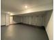 Spacious three car garage features a modern door and freshly painted walls at 5619 Mayfair Crossing Dr, Lithonia, GA 30038