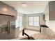 Cozy kitchen featuring stainless steel refrigerator, gas range and modern countertops at 5619 Mayfair Crossing Dr, Lithonia, GA 30038