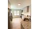 Stylish kitchen with gray cabinets, stainless steel appliances, and wood floors at 5619 Mayfair Crossing Dr, Lithonia, GA 30038