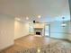 Open living room featuring a fireplace and access to outdoor space at 5619 Mayfair Crossing Dr, Lithonia, GA 30038