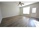 Spacious living room with hardwood floors, large windows and door to patio at 1513 Arbor Place Dr, Morrow, GA 30260