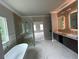 Elegant bathroom featuring a freestanding tub and double vanity at 1534 Stargrass Dr, Grayson, GA 30017