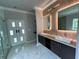 Bathroom with double vanity, marble floors and a walk in shower at 1534 Stargrass Dr, Grayson, GA 30017