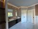 Spa-like bathroom with double vanity and marble floors at 1534 Stargrass Dr, Grayson, GA 30017
