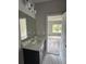 Simple bathroom with vanity, sink and view into bedroom at 1534 Stargrass Dr, Grayson, GA 30017