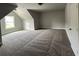 Bright bedroom featuring carpeted floors and a window at 1534 Stargrass Dr, Grayson, GA 30017