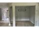 Dining area with light hardwood floors and modern chandelier at 1534 Stargrass Dr, Grayson, GA 30017
