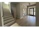 Elegant entryway with hardwood floors and double doors at 1534 Stargrass Dr, Grayson, GA 30017