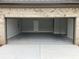 Spacious two-car garage with painted floor and ample space at 1534 Stargrass Dr, Grayson, GA 30017