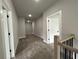 Upstairs hallway with carpeted floors and access to bedrooms at 1534 Stargrass Dr, Grayson, GA 30017