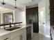 Modern kitchen with stainless steel appliances and a large island with seating at 1534 Stargrass Dr, Grayson, GA 30017