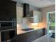 Sleek kitchen with stainless steel appliances and stone backsplash at 1534 Stargrass Dr, Grayson, GA 30017