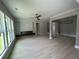 Spacious living room with hardwood floors, a fireplace, and large windows at 1534 Stargrass Dr, Grayson, GA 30017