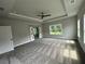 Bright and airy main bedroom with carpet flooring and large windows at 1534 Stargrass Dr, Grayson, GA 30017