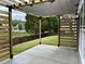 Covered patio with wooden privacy screens, offering backyard views at 1534 Stargrass Dr, Grayson, GA 30017