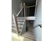 Modern staircase with light wood and black metal accents at 1534 Stargrass Dr, Grayson, GA 30017