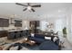 Open living room and kitchen with island, stainless steel appliances, and seating at 548 Sawnee Village Blvd # D72, Cumming, GA 30040