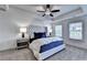 Main bedroom with king-size bed, ceiling fan, and gray carpet at 1613 Aiden Way # 54, Conyers, GA 30013