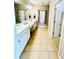 Double vanity bathroom with tiled floors and a separate shower at 4140 Lanier Ridge Walk # 104, Cumming, GA 30041