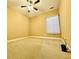 Well-lit bedroom with carpet flooring and ceiling fan at 4140 Lanier Ridge Walk # 104, Cumming, GA 30041